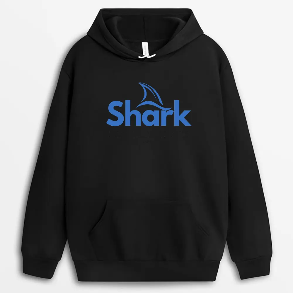 at lay of a deep navy hoodie with an artistic print of a shark fin cutting through waves, highlighting the soft brushed interior and oversized hood design.